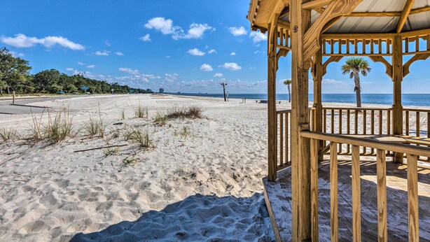 A wooden beach structure with a view of the beach and ocean. - Charming Gulfport Escape: Half-Mile to Beach! (Gulfport)