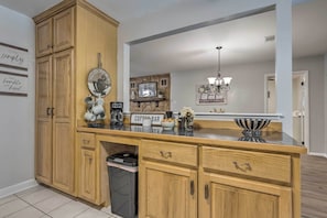 Enjoy cooking in this well-equipped kitchen with a central island and coffee bar.