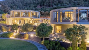A modern two-story house with large windows and a well-lit outdoor area. - Bobo by The Stay (Bodrum)