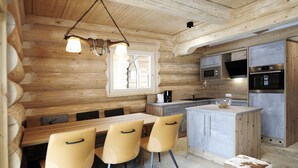 A log cabin-style kitchen with wooden walls, a dining table with chairs, and modern appliances including a microwave, oven, and sink. - Yellowstone by Summit Lodges (Pfunds)