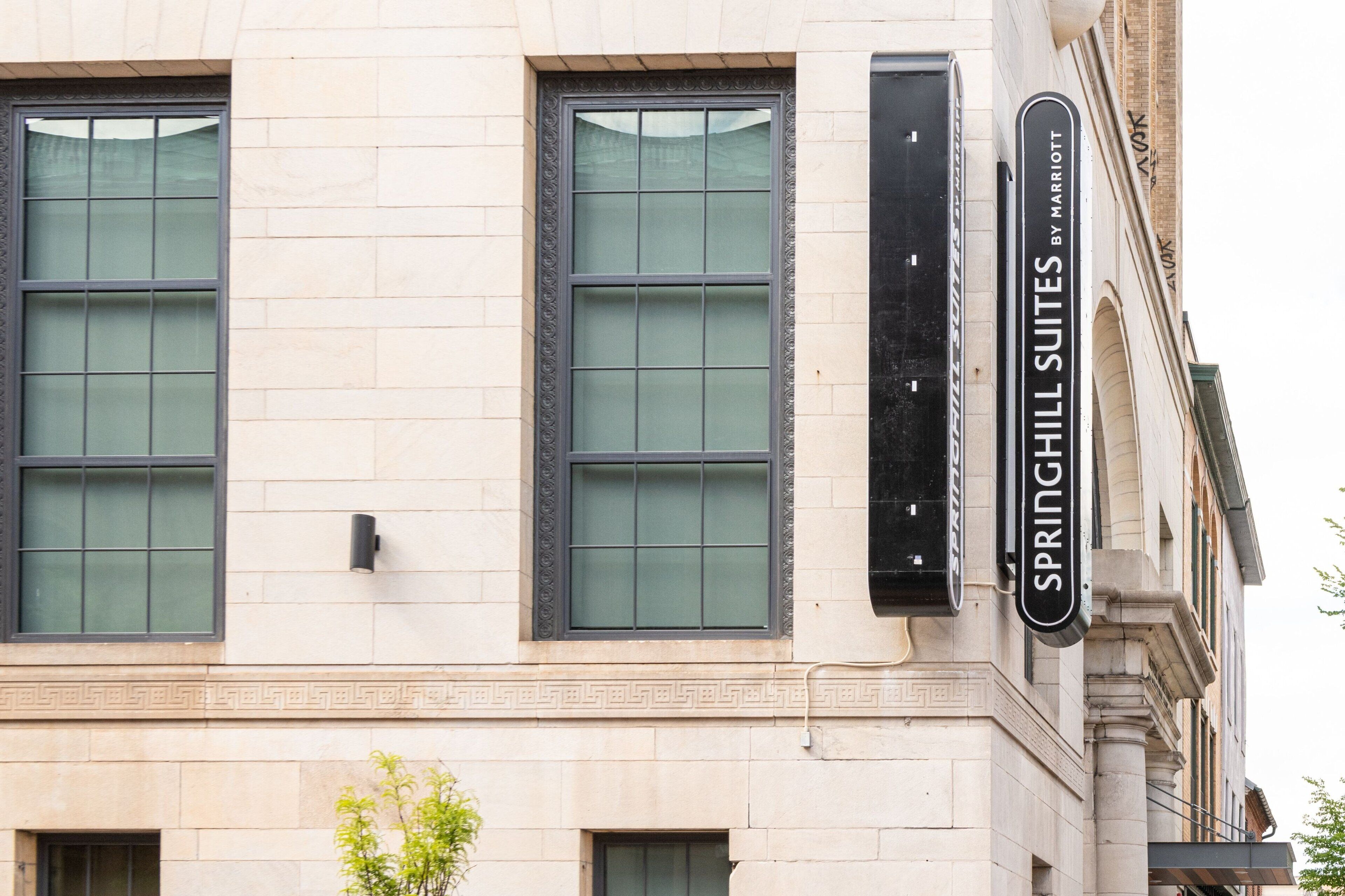 A building with large windows and a sign for Springhill Suites by Marriott.