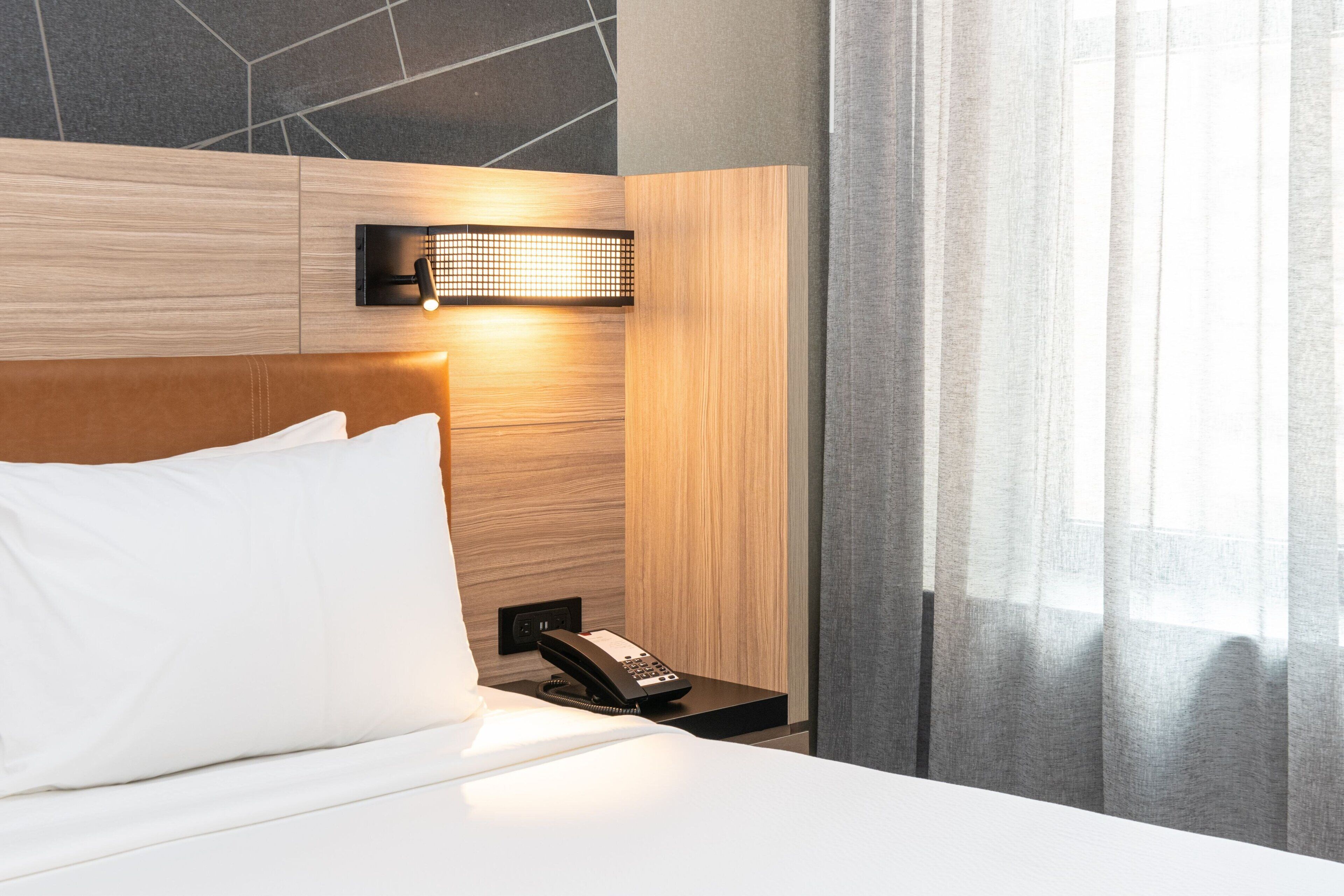 Desk, laptop workspace, iron/ironing board, free cribs/infant beds