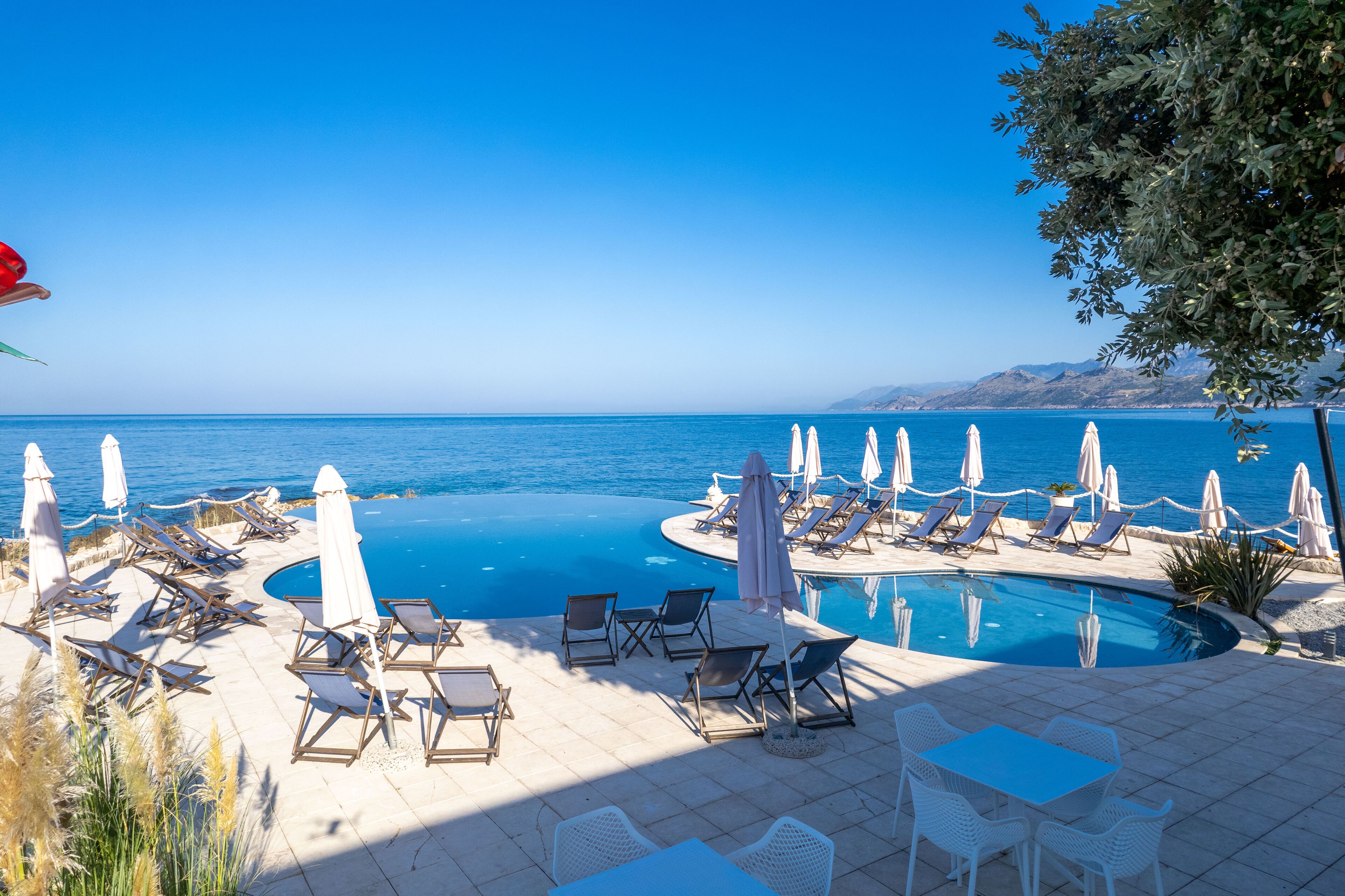 2 outdoor pools, pool umbrellas, sun loungers