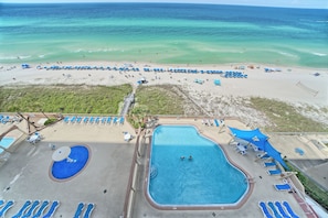 A resort with a large pool, beach area, and ocean view. - Luxury Beachfront Condo.  Spacious Balcony! Gorgeous Ocean Views!  Includes beach service! (Panama City Beach)