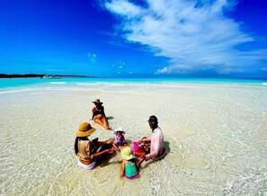 On the beach, sun loungers, beach towels - Bahamas Luxury Sailing Catamaran, Nassau to Exumas (Staniel Cay)