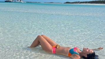 On the beach, sun-loungers, beach towels