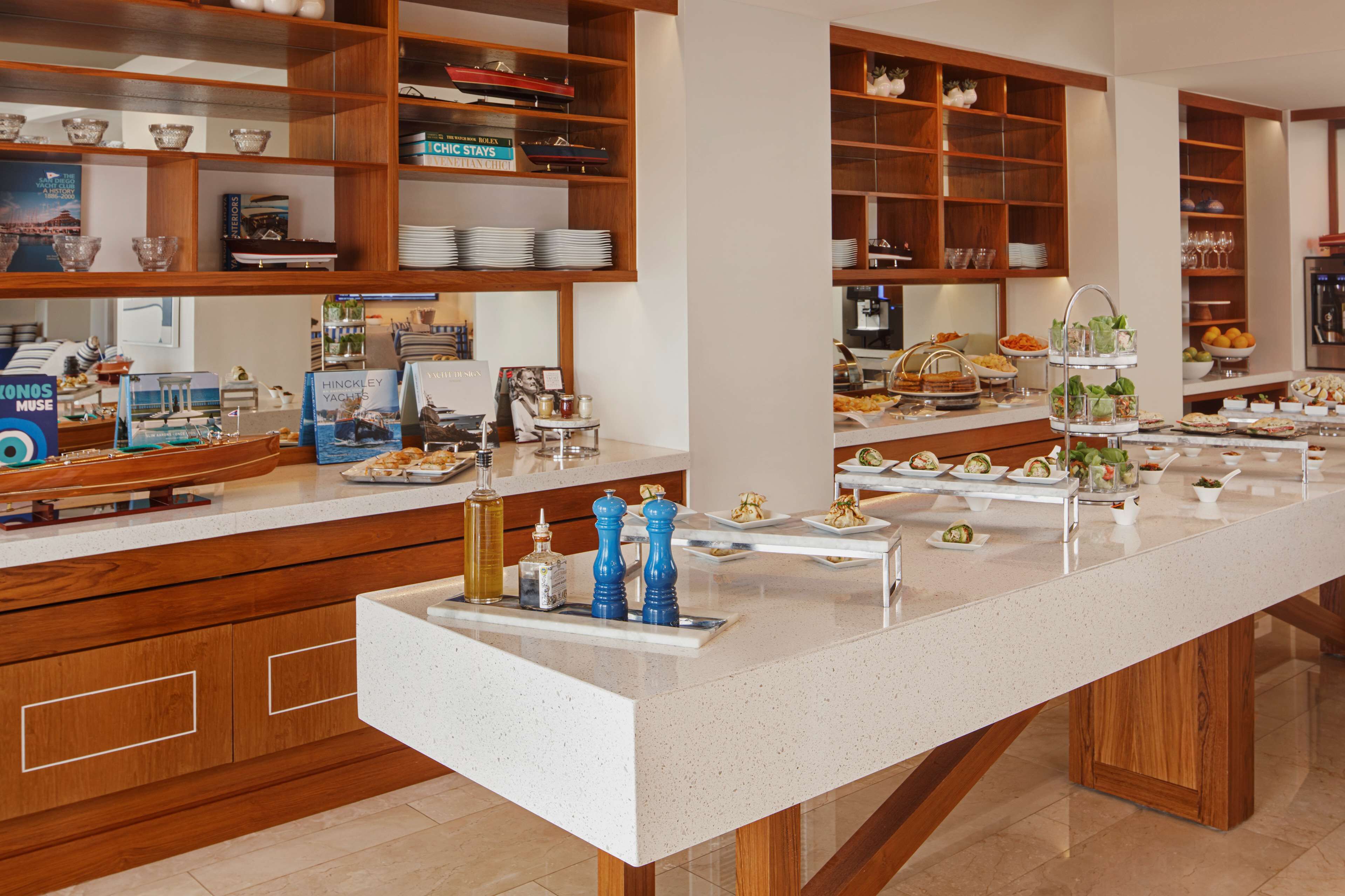 A buffet setup with various food items and condiments.