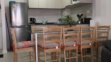 Family Apartment | Private kitchen | Fridge, cookware/dishes/utensils, dining tables