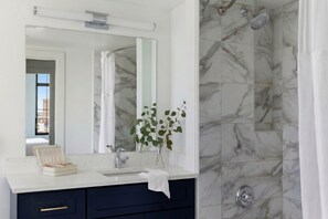 Designer toiletries, hair dryer, towels