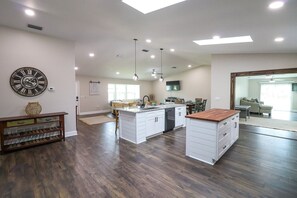 Enjoy cooking in this well-equipped kitchen with a central island and dining area.