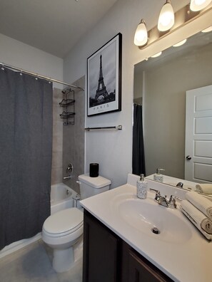 Combined shower/bathtub, hair dryer, towels, soap
