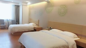A hotel room with two beds, a bedside table with a phone, and a chair. - Greentree Inn Shaoxing Binhai New City Dongsen Commercial Square Hotel (Shaoxing)