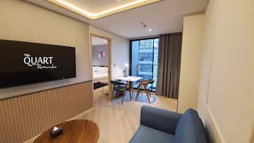 One Bedroom Suite | Living area | 50-inch LED TV with cable channels, TV