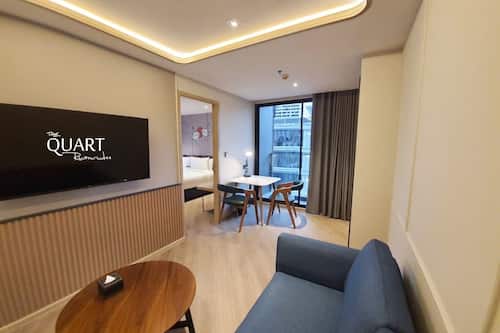 One Bedroom Suite | Living area | 50-inch LED TV with cable channels, TV
