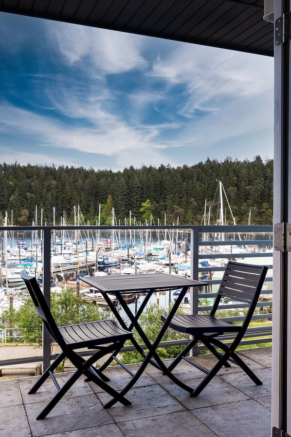 Outdoor dining - This is the life! 2 bedroom oceanfront condo close to everything. (Nanaimo)