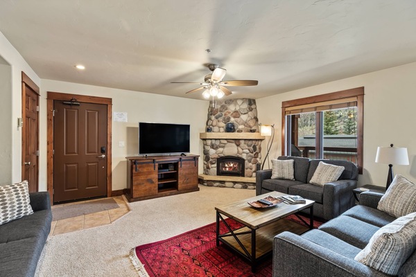 Kiick back, watch TV and warm up by the fireplace