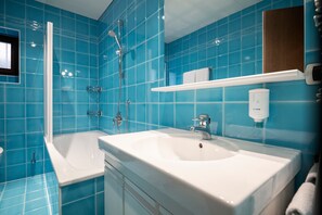 Bathtub, hair dryer, towels