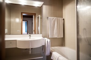 Bathtub, hair dryer, towels