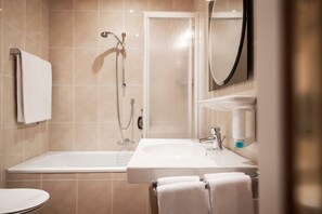 Bathtub, hair dryer, towels