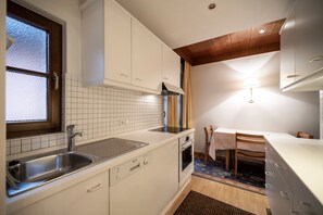 Fridge, microwave, oven, stovetop - Villa Stella Apartment N54 near the ski lift, Wi-Fi, balcony, terrace and garden (St.Ulrich)