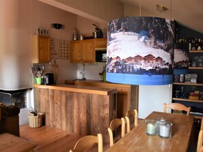 Enjoy cooking in this well-equipped kitchen with a central island and dining area.