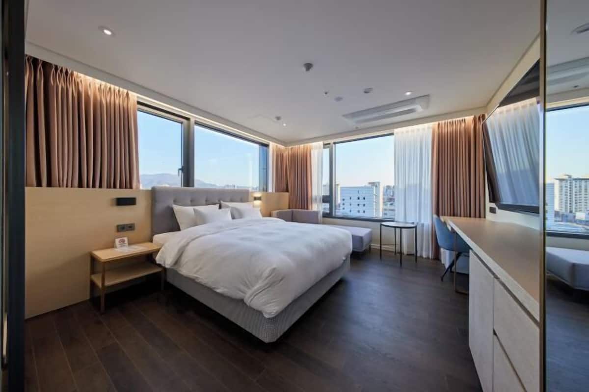 Premium bedding, down duvets, iron/ironing board (on request), free WiFi