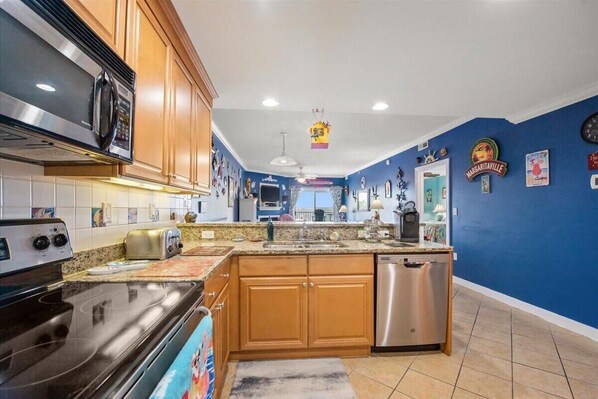 Enjoy cooking in this well-equipped kitchen with an oven, microwave, and dishwasher.