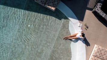 Seasonal outdoor pool, open 11:00 AM to 7:30 PM, pool umbrellas
