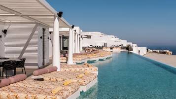 Seasonal outdoor pool, open 11:00 AM to 7:30 PM, pool umbrellas