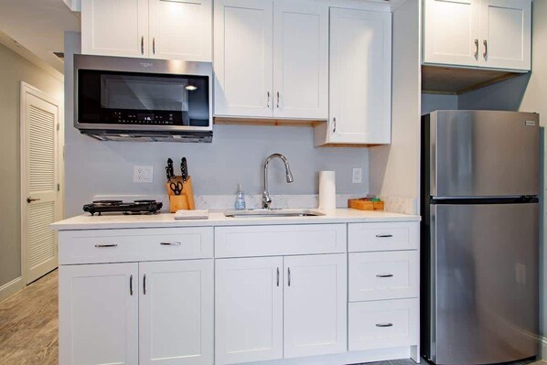 Fridge, microwave, stovetop, coffee/tea maker