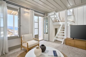 プレジデンシャル ヴィラ | リビング エリア | 45 インチのスマートテレビ (デジタル放送視聴可)、テレビ、Netflix