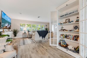 Flat-screen TV, table tennis, books