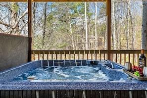 A hot tub with a wooden deck and a view of trees. - Smoky Mtn NP Hot Tub  4 Miles Downtown Gatlinburg (Gatlinburg)