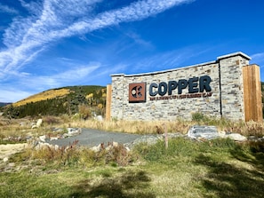 A building with a sign that reads "COPPER" and mentions base and peak elevations.