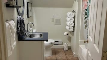 Combined shower/tub, hair dryer, towels, soap