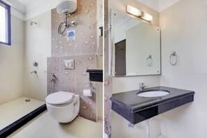 A bathroom with a shower, toilet, and sink. - Hotel Green Wood By Dreamz Hospitality (Gurugram)