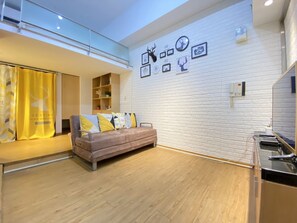 4B | Living area | 30-inch TV with cable channels - Tokyo Loft duplex apt (Taipei)