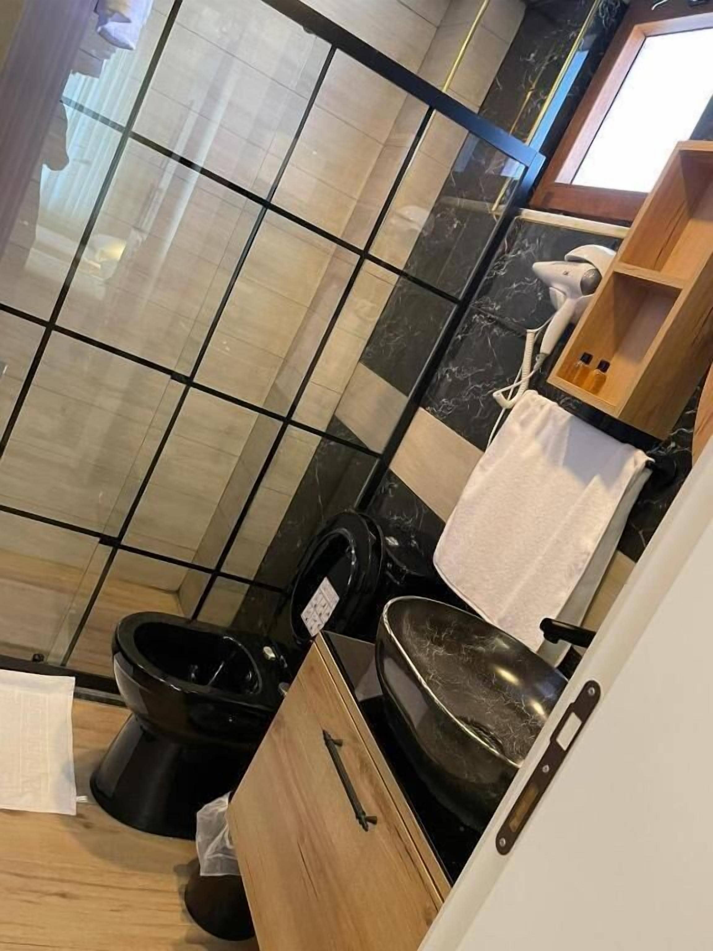 shower, rainfall showerhead, slippers, towels