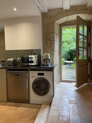 Enjoy cooking in this well-equipped kitchen with a dishwasher, microwave, toaster, and coffee maker.