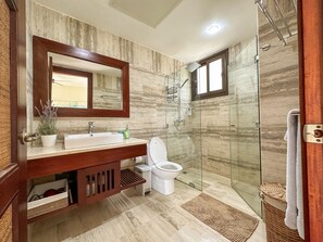 Shower, hair dryer, towels, soap