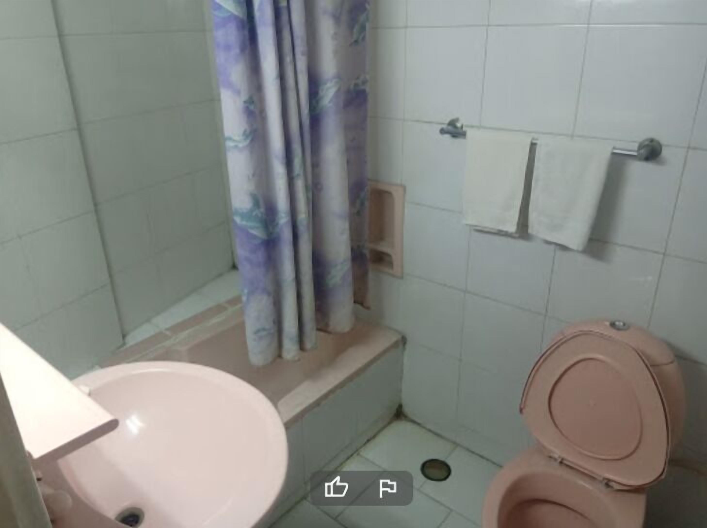 deluxe triple room | bathroom | shower, slippers, towels