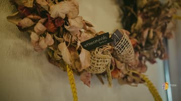 Dried flowers arranged on a surface with tags, possibly for decoration or display.