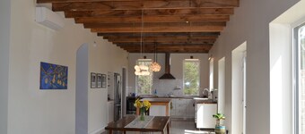 Stone Eco House on 120 acres with a pond, meadows, brook, and hiking trails.