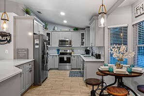 Coffee/tea maker, fridge, microwave, oven
