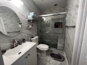 Bathtub, hair dryer, towels, soap