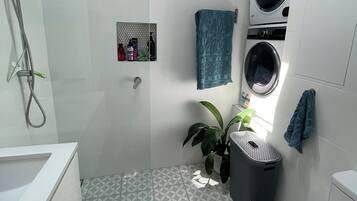 Shower, hair dryer, towels, soap
