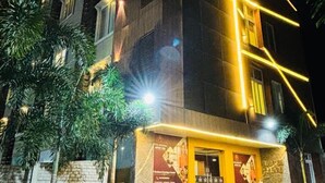 A multi-story hotel with a modern facade, featuring a prominent staircase leading to the entrance. - Hotel Signature Airport zone hyderabad (Hyderabad)