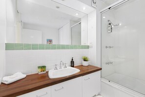 Shower, hair dryer, towels, soap