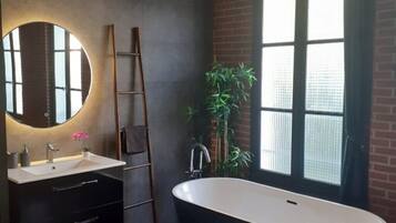 Bathtub, hair dryer, towels, soap