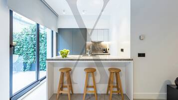 Deluxe Duplex | Private kitchen | Full-size fridge, microwave, oven, stovetop